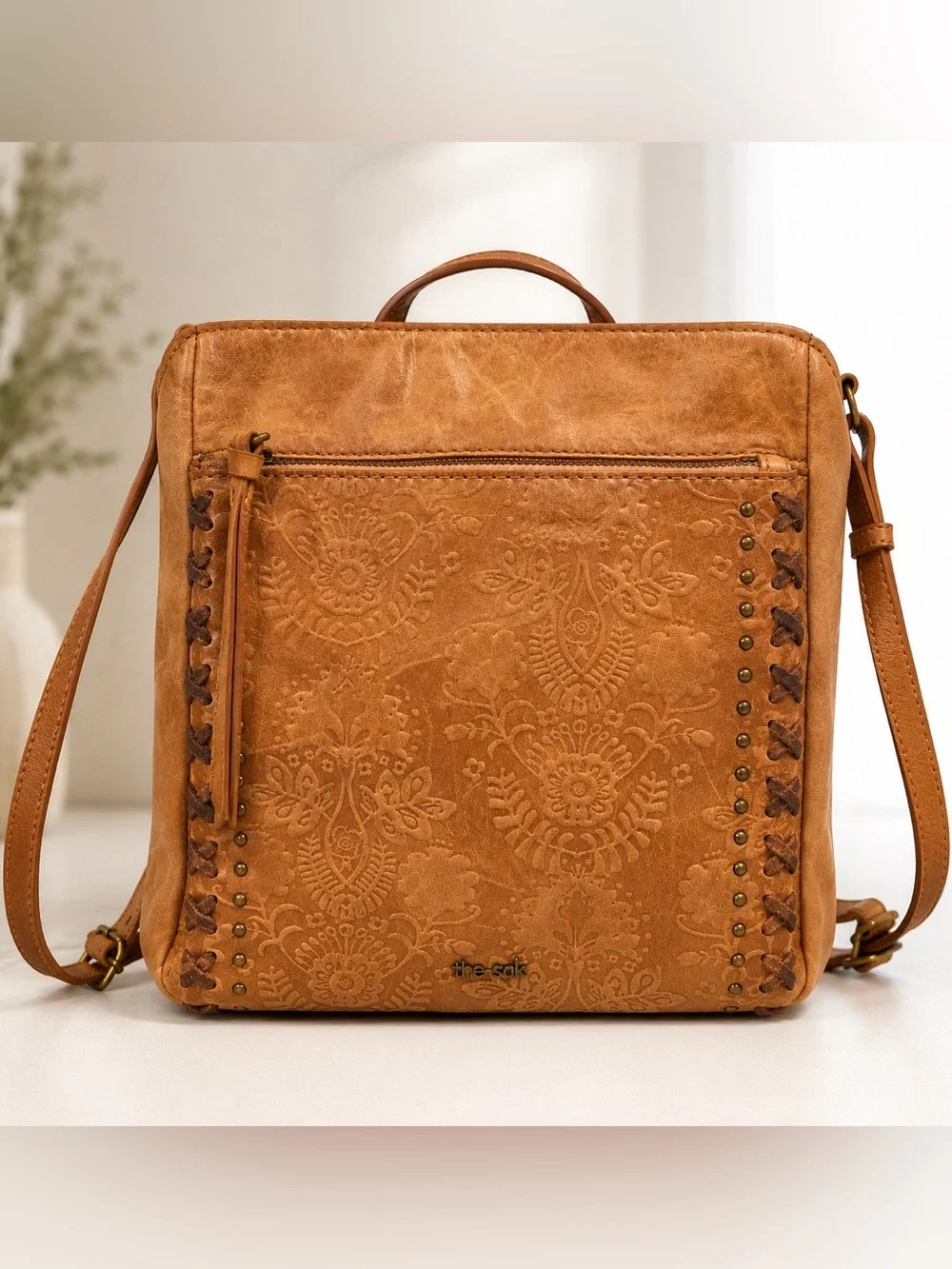 The Sak Tan Embossed Leather Backpack with Stud & Lacing Details